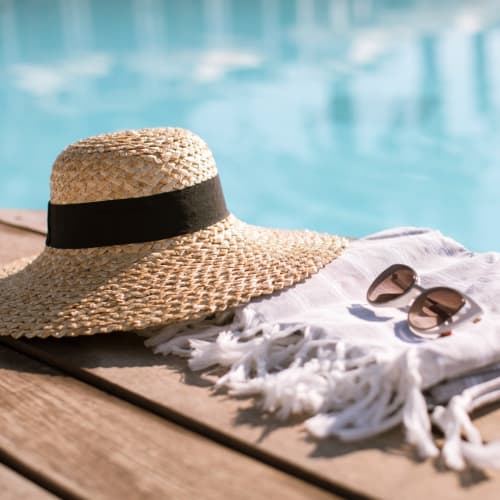 A hat and sunglasses next to a pool at Lovell Cove in Patuxent River, Maryland