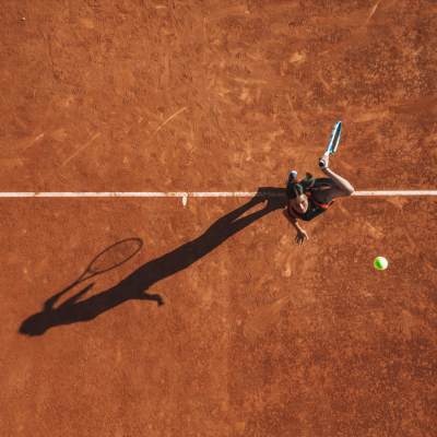 Resident playing tennis at Emerald Grove in Orlando, Florida, 