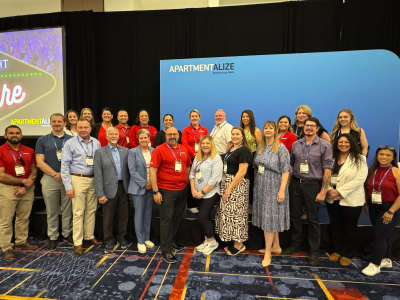 Liberty Military Housing's team mambers pose for a group picture at NAA's Apartmentalize 