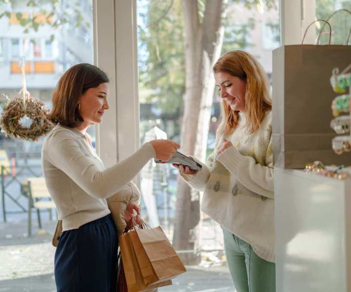 Resident doing payment in a nearby shop at Cape Fear Townhomes in Fayetteville, North Carolina