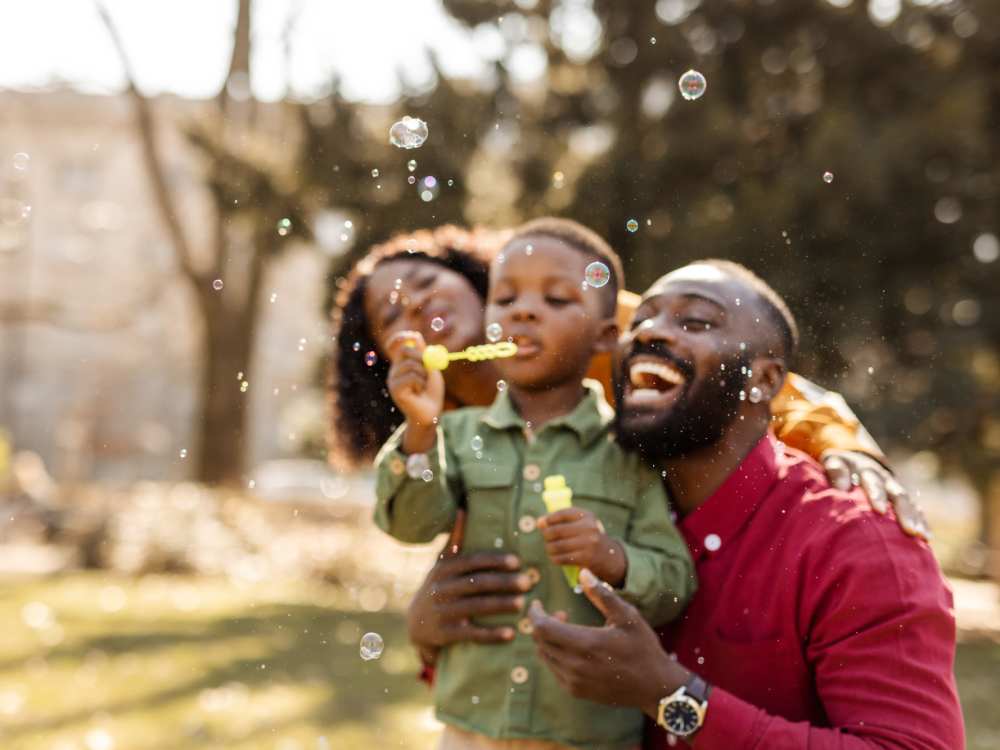 Residents enjoying blowing soap bubbles in a park near The Reserve at Brookhaven in Palm Coast, 