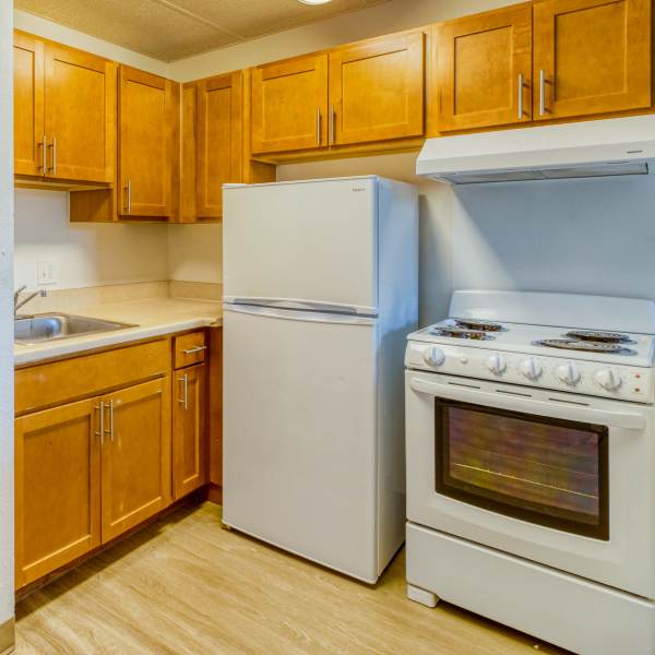 Living room and pass-through to the kitchen of a model apartment at Argonaut/El Tovar Apts in Denver, Colorado