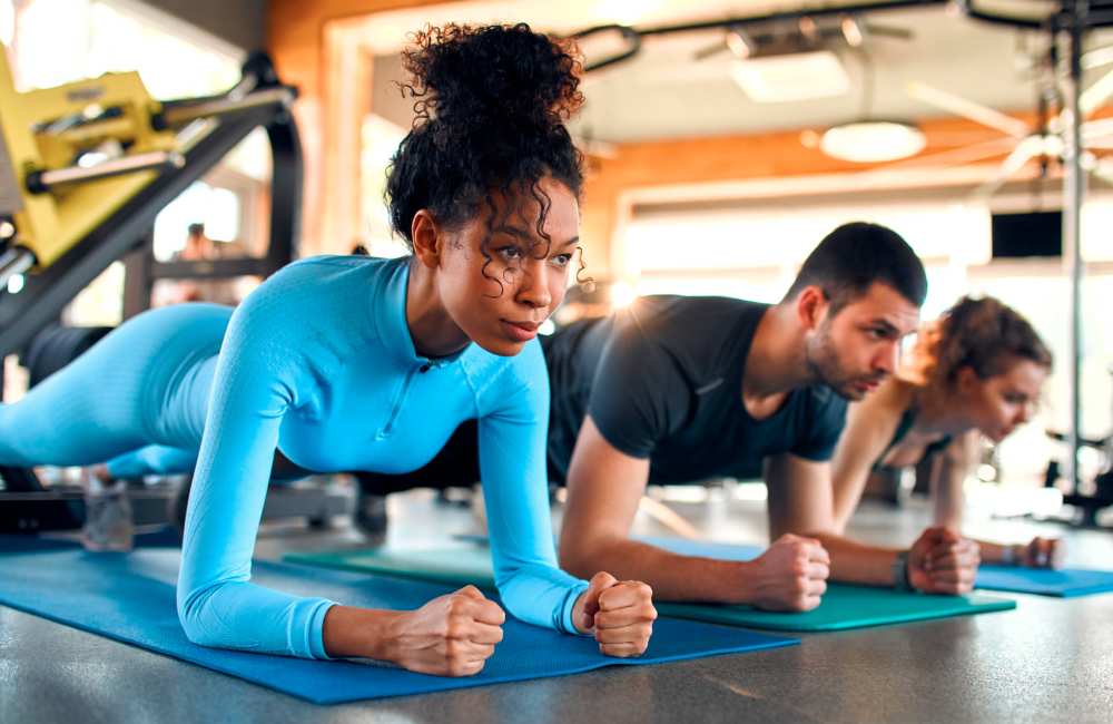 Residents doing exercise in fitness center at The Morgan in Bedford, Texas