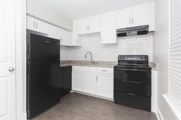 Kitchen with black appliances at The Hills at Oakwood Apartment Homes in Chattanooga, Tennessee