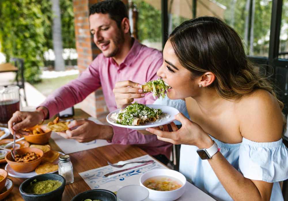 Resident couple having a meal at a restaurant near Cotton Wood Apartments in Dublin, California