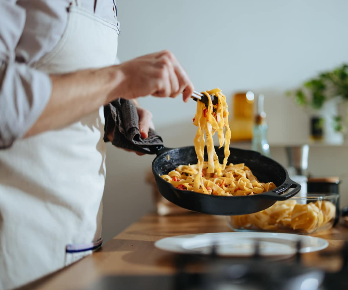 Resident cooking at Legacy On Kiest in Dallas, Texas