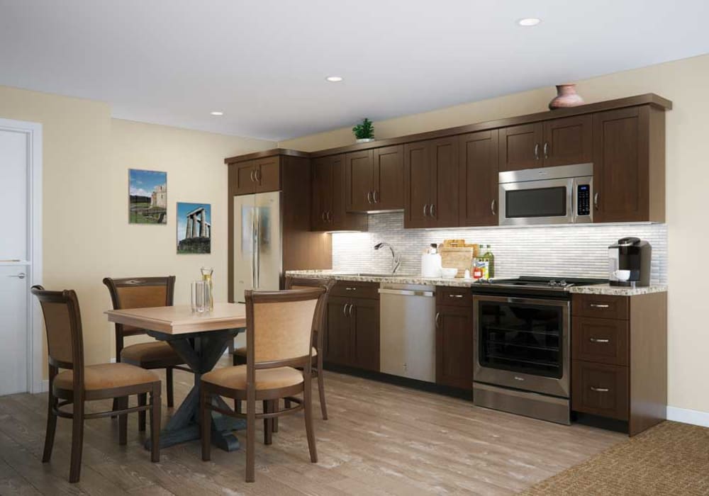 A kitchen with wood flooring in an apartment at Touchmark on West Century in Bismarck, North Dakota
