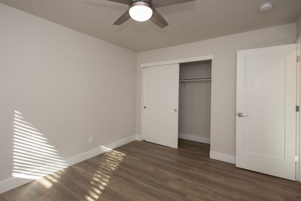 Bedroom with closet and ceiling fan at Meritage Apartments in Lodi, California