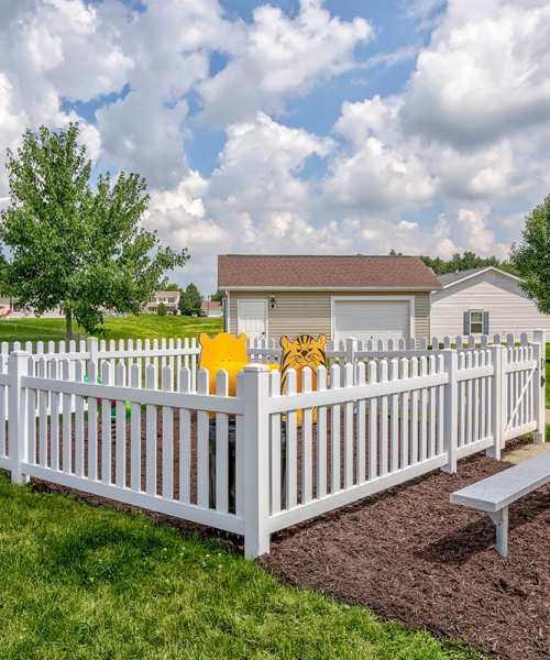 Playground fence with animal decorations at Orchard Glen in Orrville, Ohio