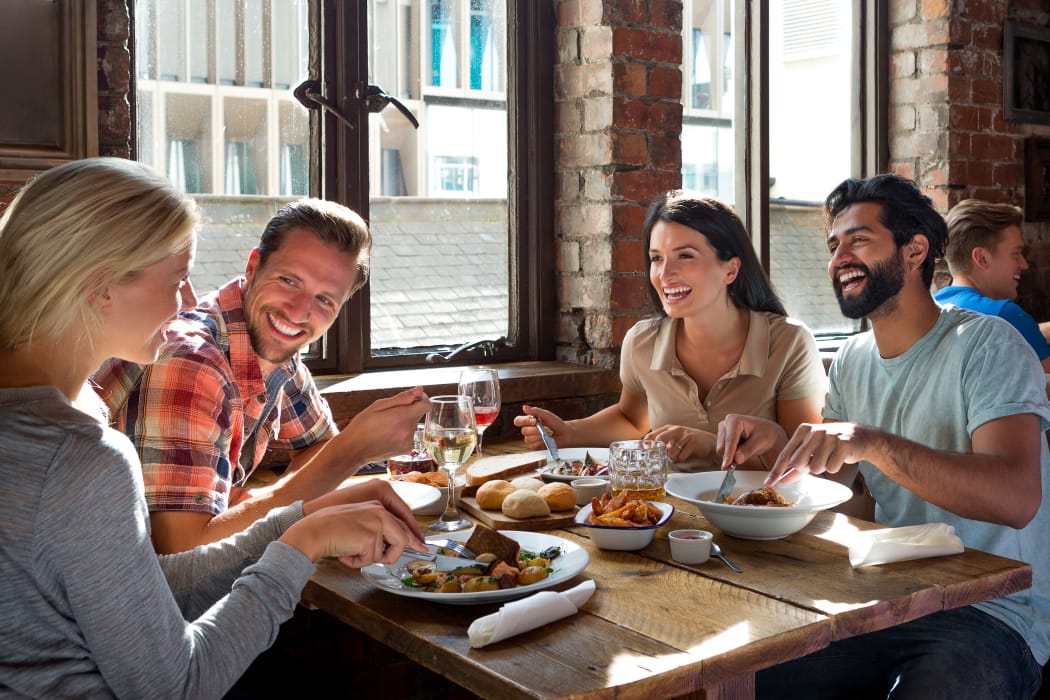 Friends enjoying lunch near Persimmon Square Apartments in Oklahoma City, Oklahoma