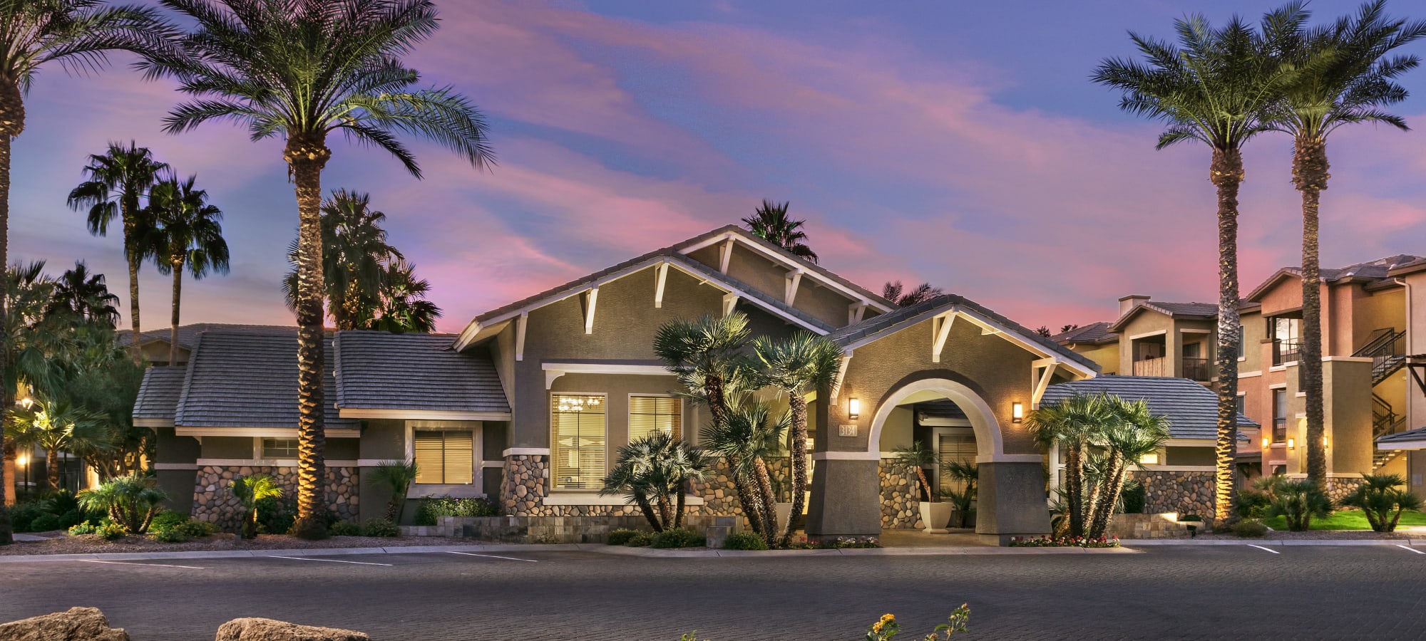 Stunning exterior of leasing office at Azul at Spectrum in Gilbert, Arizona during sunset