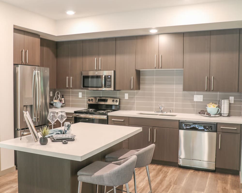 Kitchen with appliance at Sutter Green Apartments in Sacramento, California