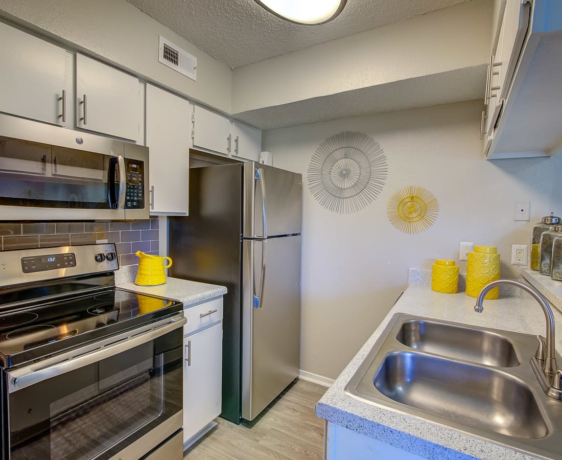 Stainless-steel appliances in a kitchen at Canyon Grove in Grand Prairie, Texas