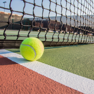 Tennis Ball on tennis court at Sienna Heights Apartments apartment homes in Lancaster, California