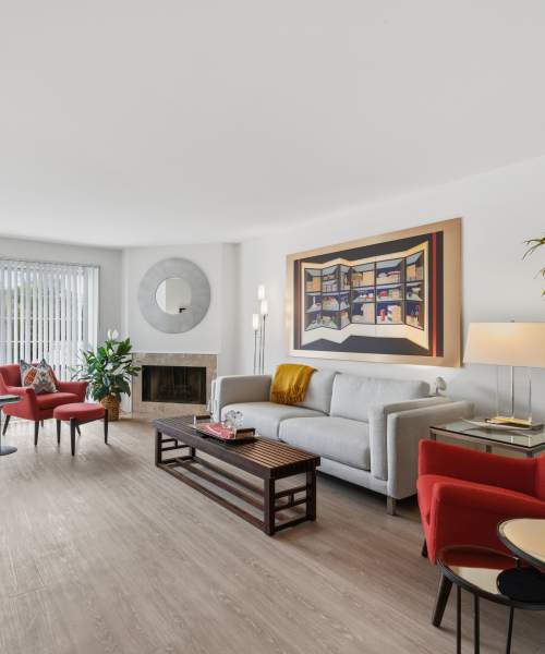 Living room with sofa and fireplace at Aldingbrooke in West Bloomfield, Michigan