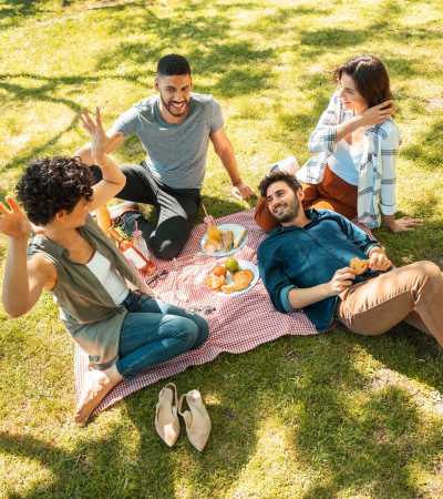 Happy friends enjoying in the park near The Gramercy Residences in Las Vegas, Nevada