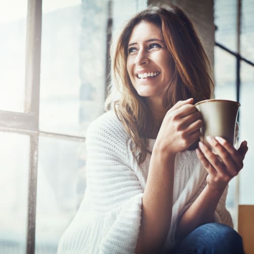 A resident setting and having her coffee at Forster Hills in Oceanside, California