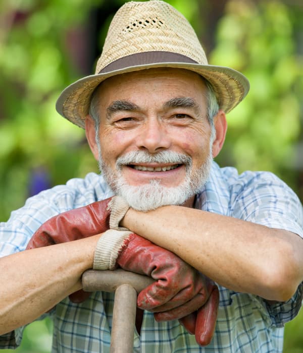 resident at Brightwater Senior Living of Capital Crossing gardening