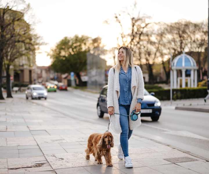 Resident walking with her dog near Cypress Oaks in Leesburg, Florida