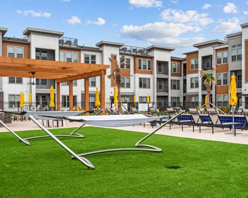 Hammocks by the pool at Opal Point At Kyle in Kyle, Texas