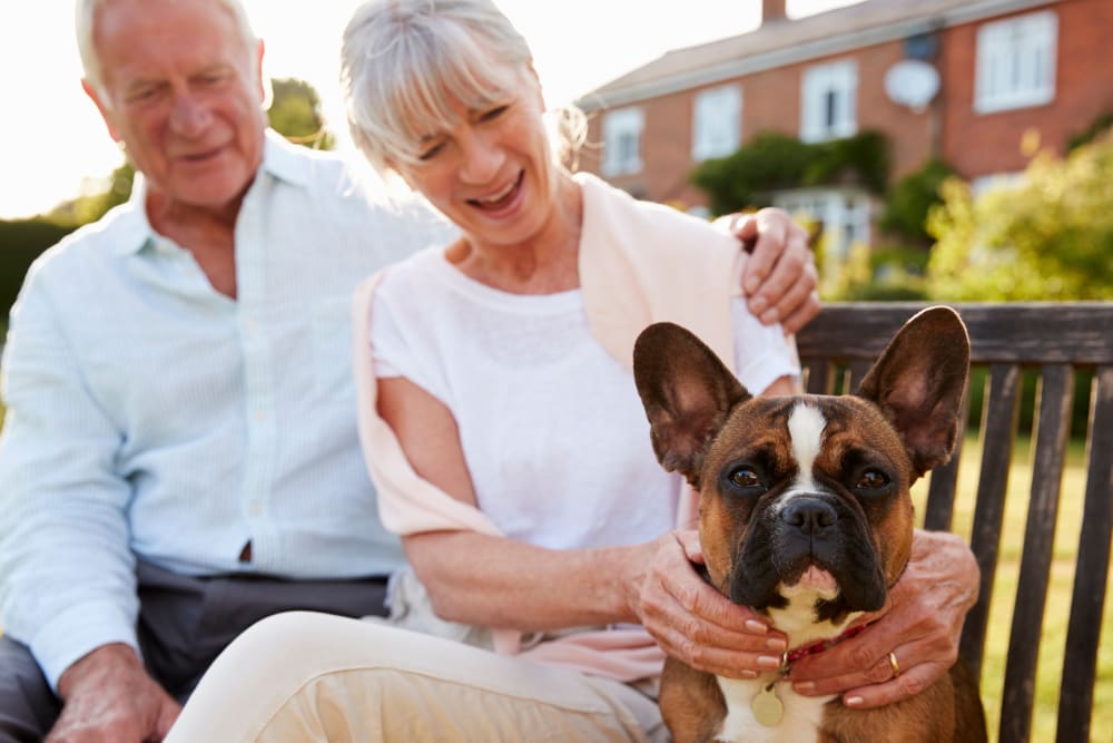A resident couple with their dog at Regency Palms Colton in Colton, California.