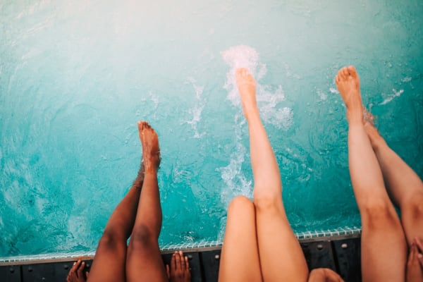 Resident dipping their toes in the pool at James River Pointe in Richmond, Virginia