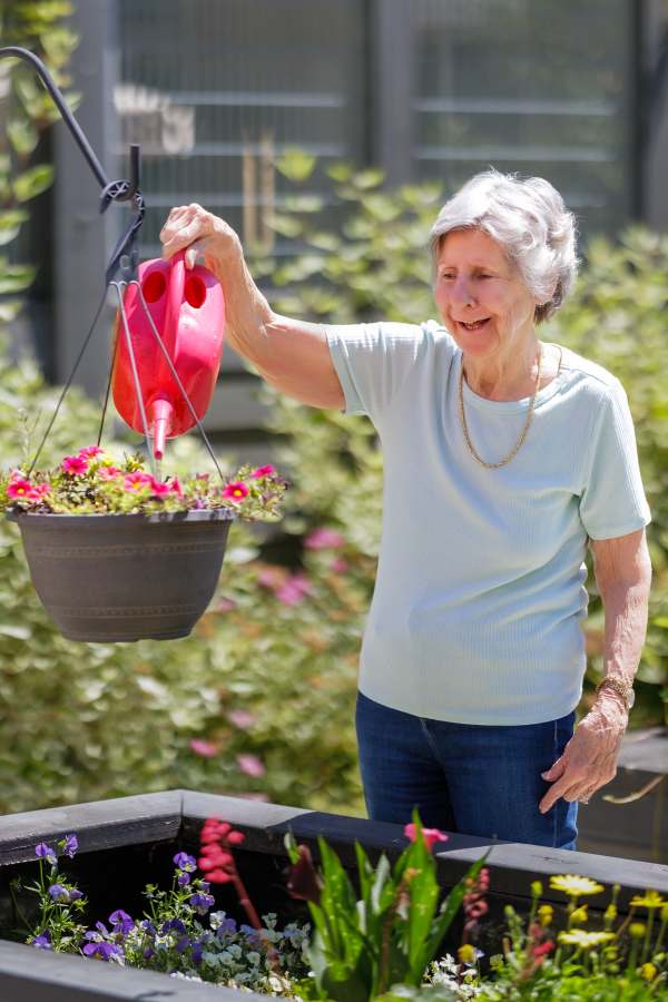 resident at Merrill Gardens Burien in garden
