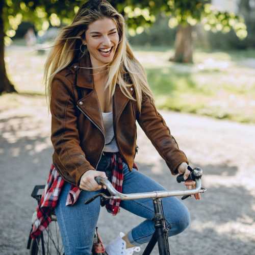 Residents riding bike on a paved path near The Kensington in Charlotte, North Carolina