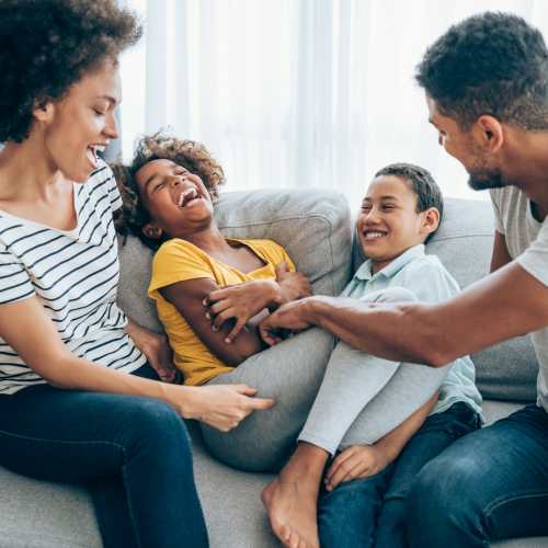 A happy family in their home at Artisan Living Mills River in Mills River, North Carolina