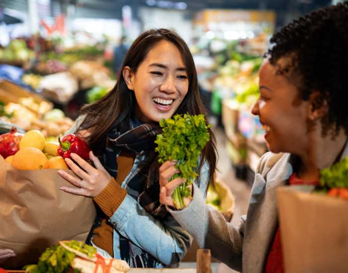 Resident women shopping groceries in a nearby grocery store at Reserve at Jacksonville Commons in Jacksonville, North Carolina