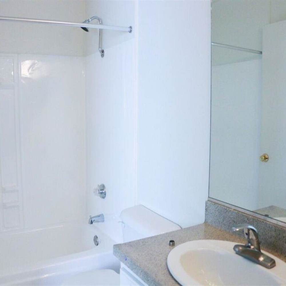 Bathroom with bathtub at Casa Madrid in Cypress, California
