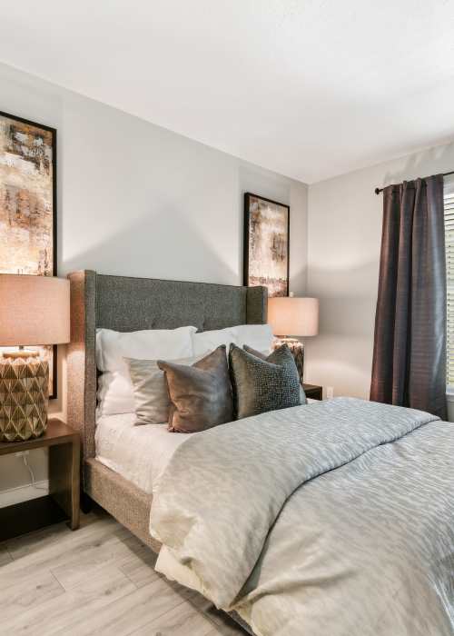 Modern bedroom with side table and lamp at Wesley in Raleigh, North Carolina