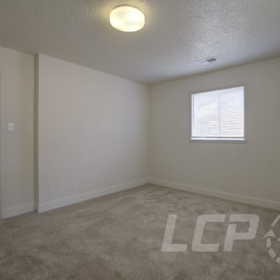 Well-lit bedroom at Beachwood South in Joint Base Lewis McChord, Washington