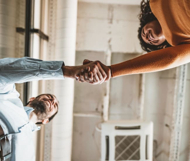 Employee and new hire of Ray Stone Inc. shaking hands 