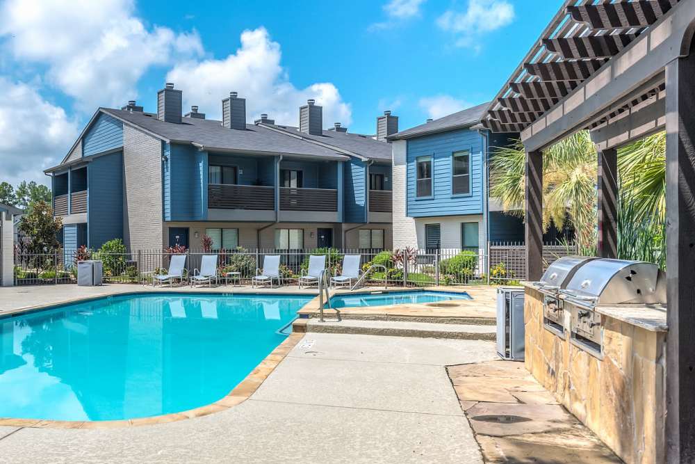 BBQ area beside the pool at The Brighton in Houston Texas