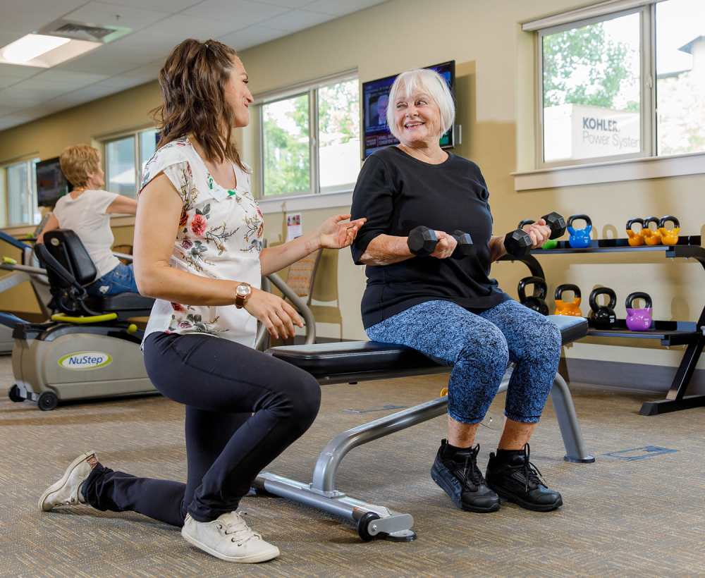Resident with physical therapist at Touchmark at Meadow Lake Village in Meridian, Idaho