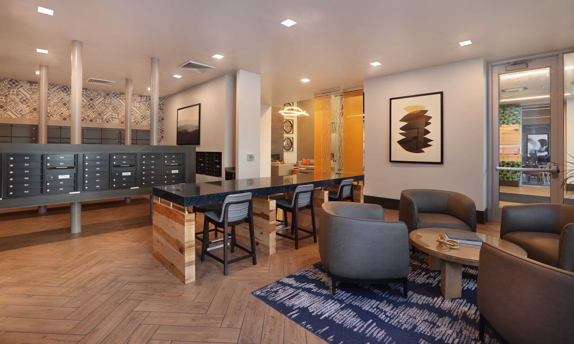 Uber lounge with curved chairs and mail room at Luxury high-rise community of Liberty SKY in Salt Lake City, Utah