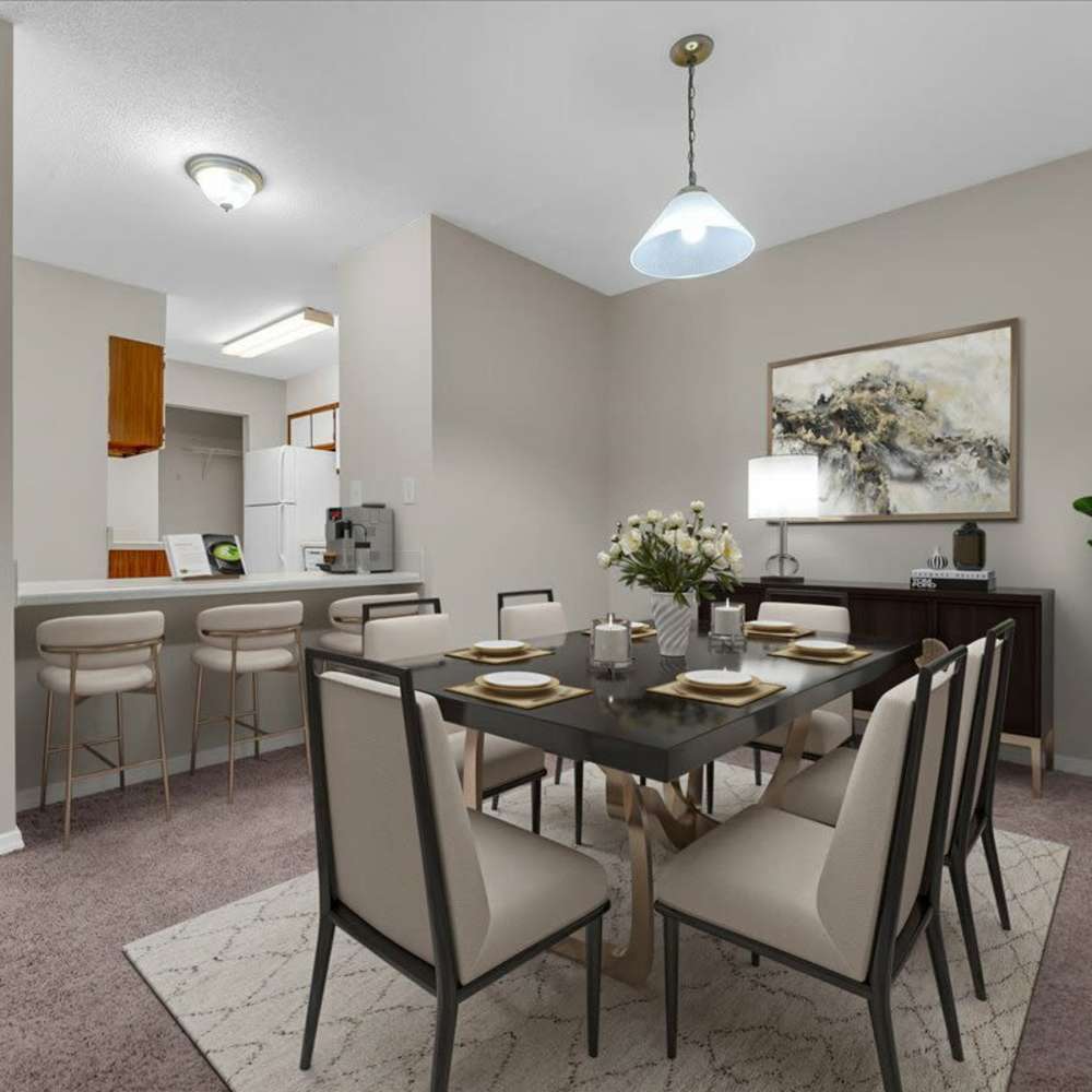 Dining area with a kitchen island at Woodbrook in Gardendale, Alabama