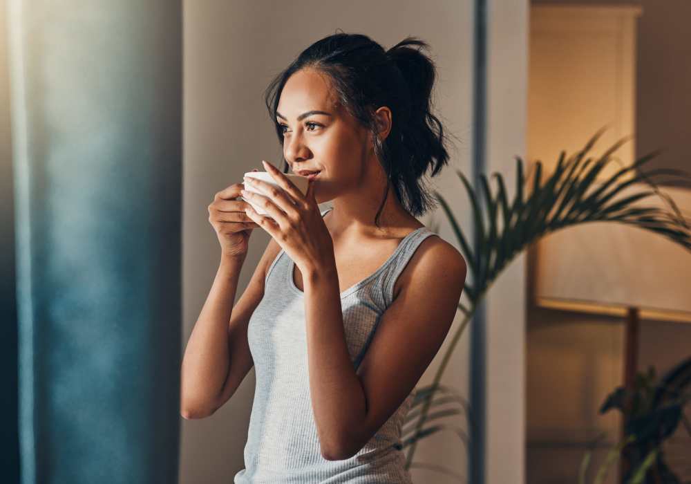 A resident drinking coffee in her apartment at Dozier Apartments in Jacksonville, Florida