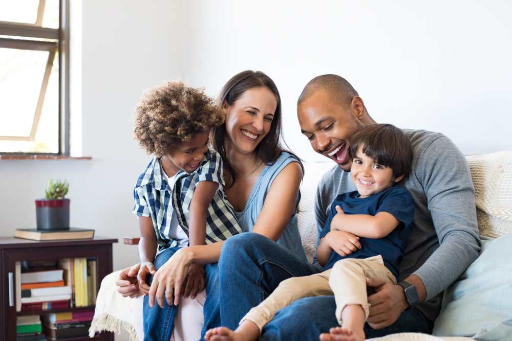 Resident family having their family time in their living room at Harrison Lofts in Davenport, Iowa