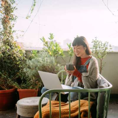 Woman working in her balcony at Tryon Farms in Charlotte, North Carolina