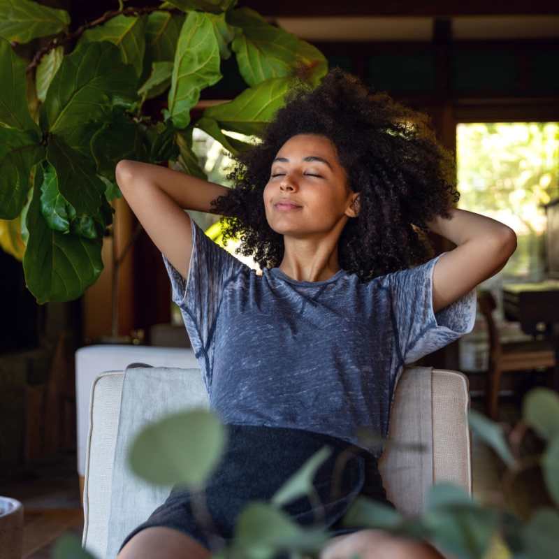 A resident relaxes in her apartment at Mason Avenue, Alexandria, Virginia