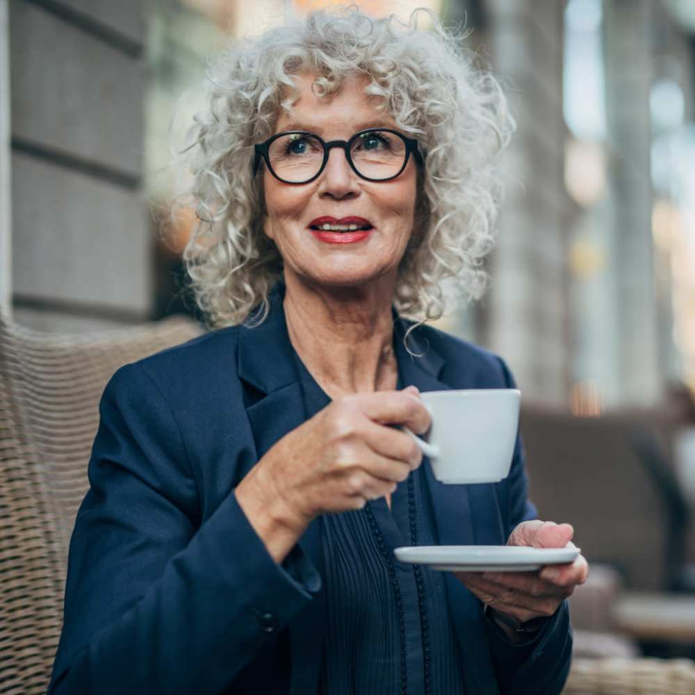 Resident drinking coffee at Grande Oak III in Williamsburg, Virginia