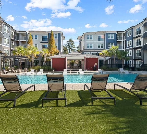 Lounge chairs on the pool deck at The Lively Indigo Run in Ladson, South Carolina