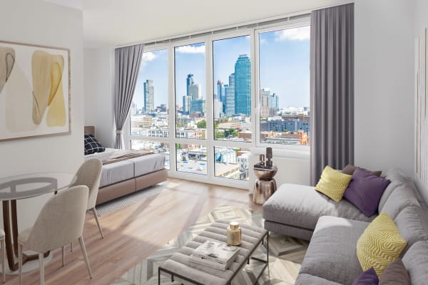 Studio apartment living room with an amazing view at The Maximilian in Queens, New York
