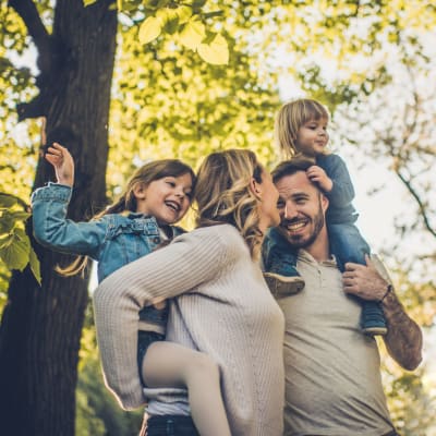 A family playing at a park near Greenwood in Joint Base Lewis McChord, Washington