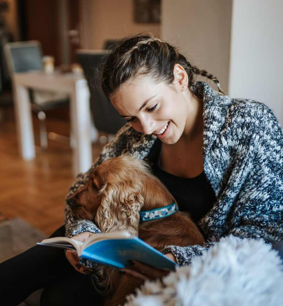 Resident hugging her dog at The Landing Lawrence in Lawrence, Kansas