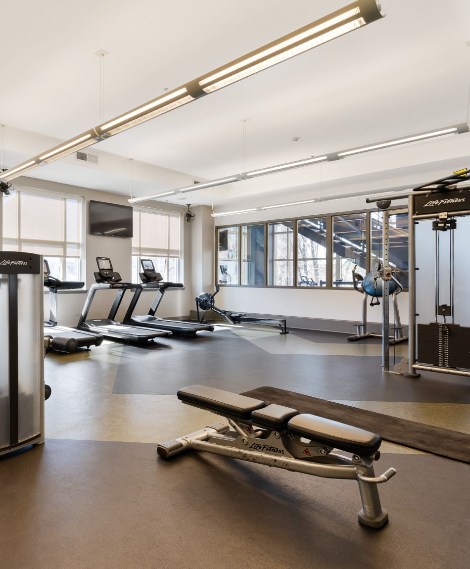 Residents staying in shape in the fitness center at Sofi at 50 Forest in Stamford, Connecticut