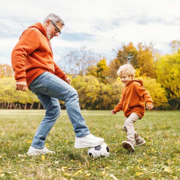 Father and child playing soccer at The Residences at New Longview in Lee's Summit, MO
