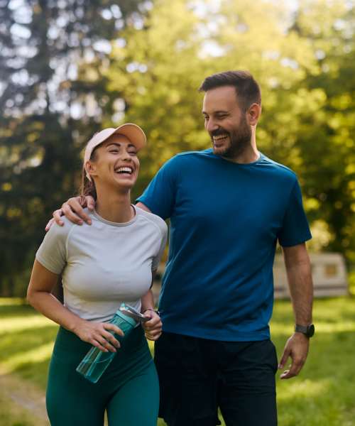 Resident couple walking park near Pheasant Run Townhomes in Harrisonburg, Virginia